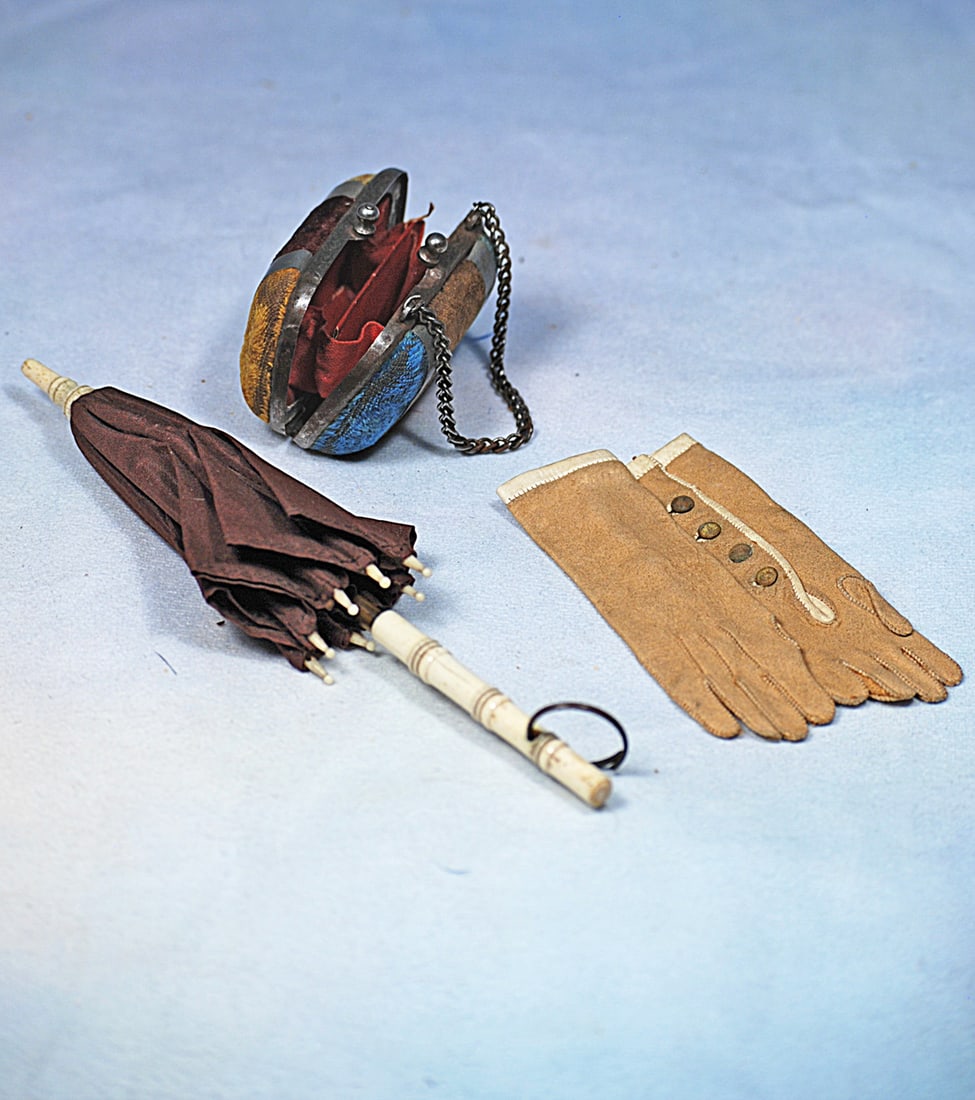 DOLL PURSE, GLOVES AND SILK PARASOL: 7 ½” brown silk parasol has bone handle, tip and points, metal fittings; 2” x 2 ½” velvet purse with metal bands, link chain, red envelope style interior; pair of 3 ½&