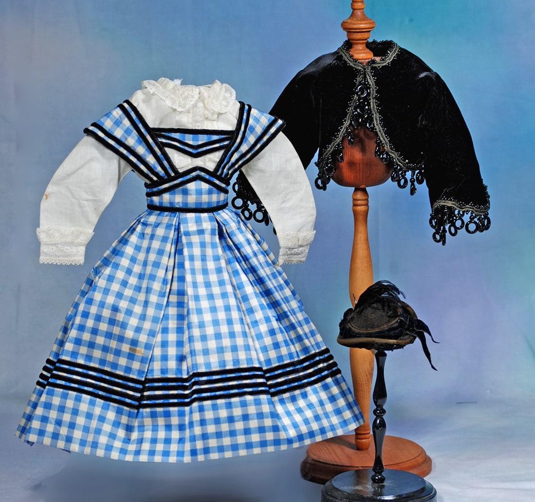 BLUE AND WHILE SILK FASHION ENSEMBLE: Comprising a blue and white silk checkered gown with fitted waist band and wide center panel supporting the wide shoulder straps, box-pleated skirt, all trimmed in narrow black velvet bands, plus a