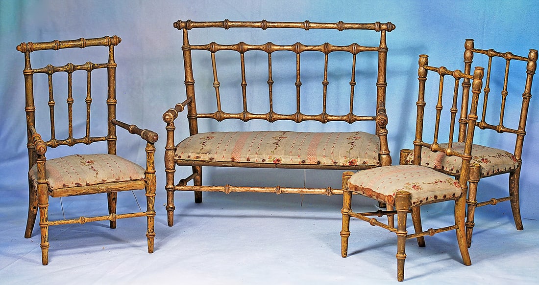 ENSEMBLE FRENCH GILDED WOODEN DOLL SALON FURNISHINGS WITH SILK UPHOLSTERY: Each is nicely shaped in faux bamboo style with gilded finish, silk print upholstery; set comprising 11” H. x 12” W. settee, one arm chair and two side chairs.