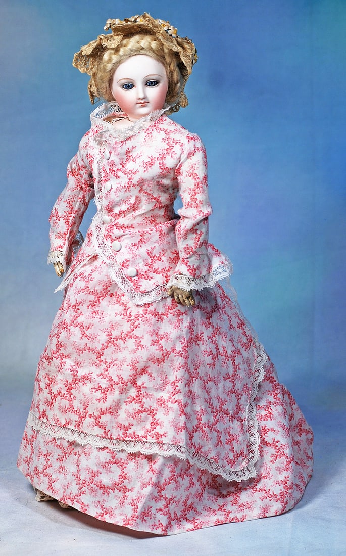 BEAUTIFUL FRENCH BISQUE POUPEE BY DOLEAC WITH PORTRAIT-LIKE FACE: 4”. Marks: 2. Bisque swivel head on bisque shoulderplate, almond-shaped blue paperweight eyes, painted lashes, dark eyeliner, feathered brows, pierced-in ears, closed mouth, accented