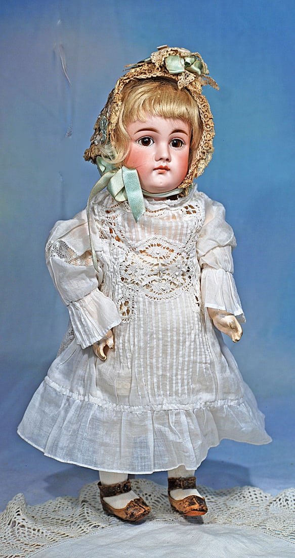 GERMAN BISQUE CLOSED MOUTH DOLL BY KESTNER: 14”. Marks: 9. Bisque socket head with long-face modelling, brown sleep eyes, painted lashes, eyeliner, feathered and brushstroked brows, closed mouth, accented lips, original blonde
