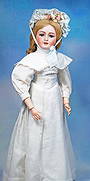 GERMAN BISQUE LADY DOLL BY SIMON & HALBIG: 24”. Marks: Simon & Halbig 1159. Bisque socket head, blue sleep eyes, painted and applied lashes, feathered brows, pierced ears, open mouth, accented lips, upper teeth, antique blond