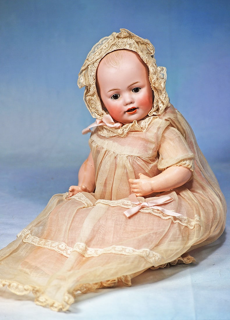 GERMAN BISQUE CHARACTER BABY IN ORIGINAL COSTUME BY KESTNER: 13”/ Marks: JDK made in Germany. Solid dome bisque socket head, painted baby hair, brown sleep eyes, brown sleep eyes, painted lashes, feathered brows, open mouth, accented lips, upp