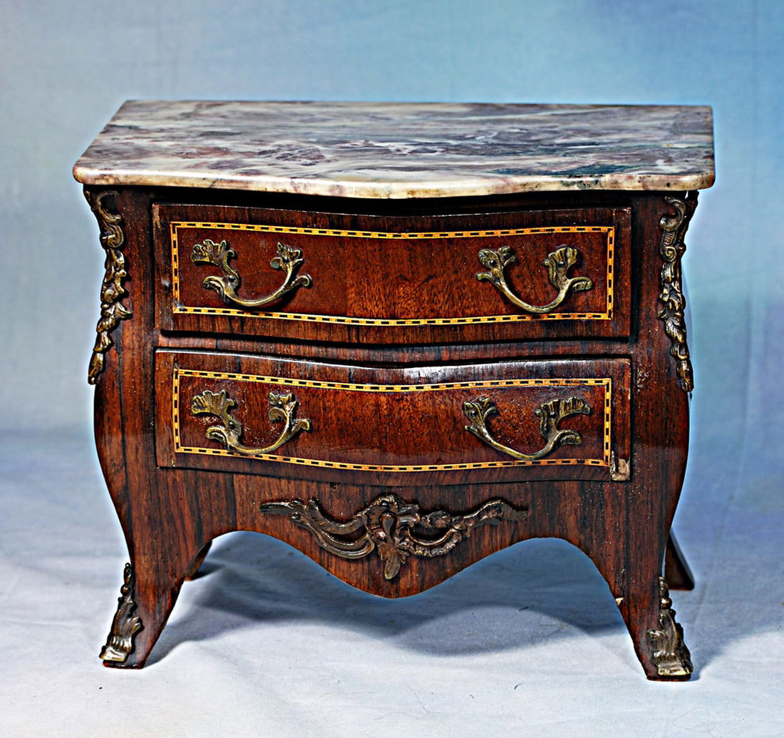 FRENCH LOUIS VX STYLE MAITRISTE CHEST: 12” x 10 ¼”. Fine mahogany with inlay grained panels, bombe-shaped sides and front, marble grey/brown top, two drawers, bronze drawer pulls and elaborate mounts and