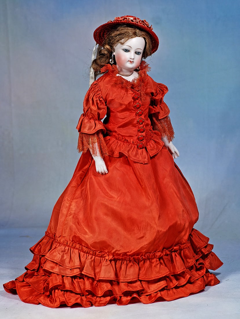 PETITE FRENCH BISQUE POUPEE BY GAULTHIER: 15”. Marks: 3. Bisque swivel head on bisque shoulderplate, blue paperweight eyes, painted lashes, eyeliner, multi-stroked brows, pierced ears, closed mouth, accented lips, antique br