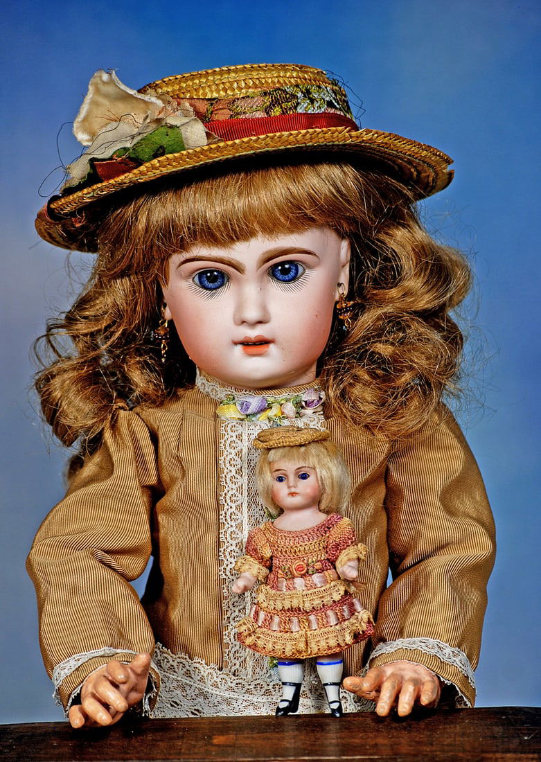 GERMAN ALL-BISQUE DOLL BY KESTNER: 4”. Marks: None. All-bisque doll jointed at shoulders, stiff hips with muscular shaped legs, painted two-strap black bootines, white knee socks, stationary cobalt blue glass eyes, cl