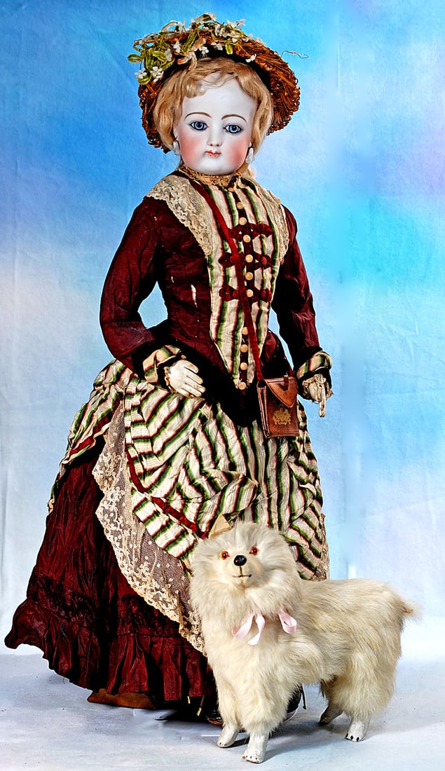 FRENCH BISQUE POUPEE BY GAULTHIER: 23”. Marks: 7. Bisque swivel head on bisque shoulderplate, blue paperweight eyes, painted lashes, eyeliner, feathered brows, closed mouth, shaded and accented lips, pierced ears,