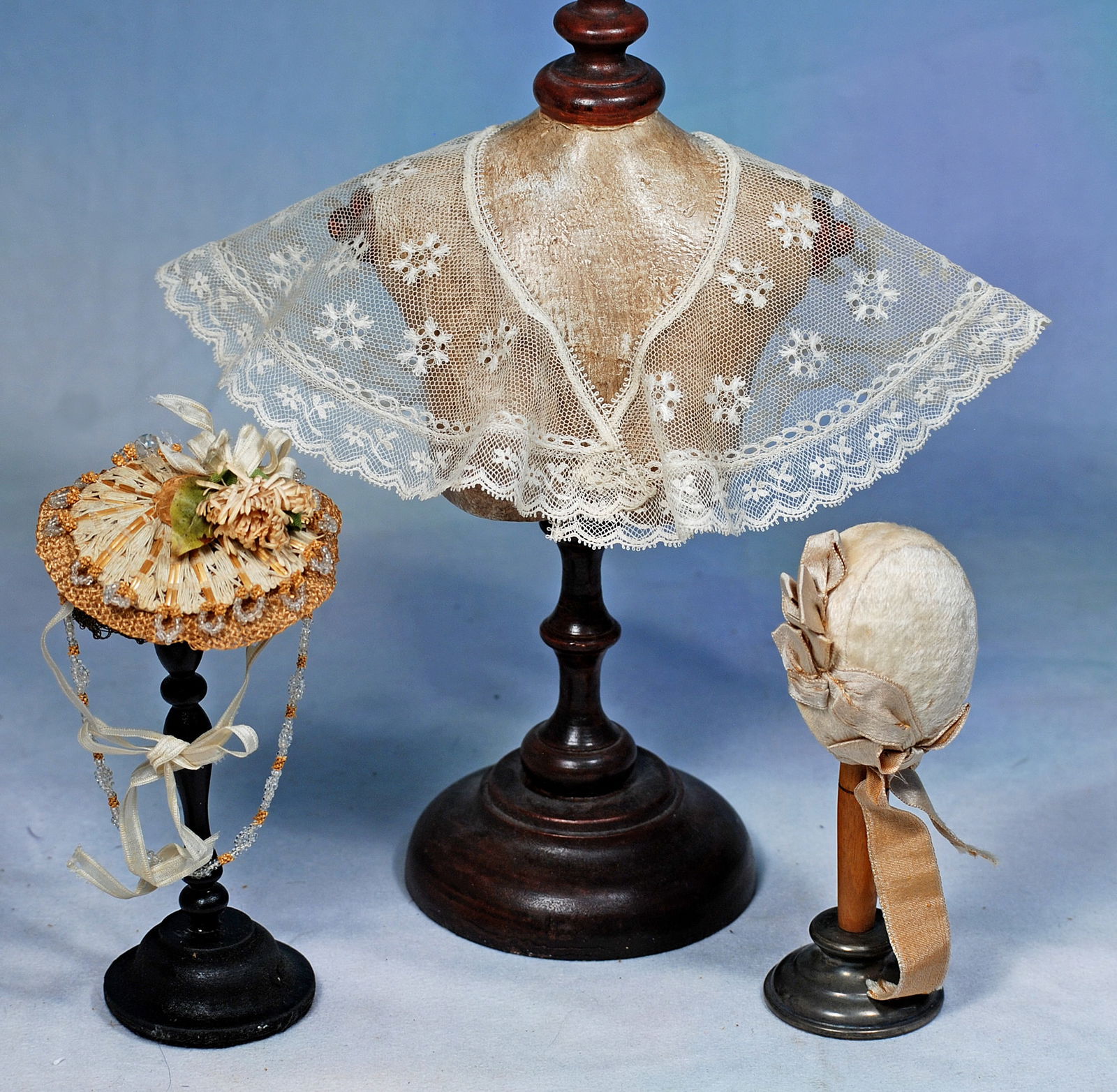 LACE SHAWL AND TWO BONNETS FOR POUPEE: 253. LACE SHAWL AND TWO BONNETS FOR POUPEE. Dainty white lace shawl with fancy lace edging; woven straw bonnet with silk bows and ribbons embellished with tiny crystal beads and droplets; white