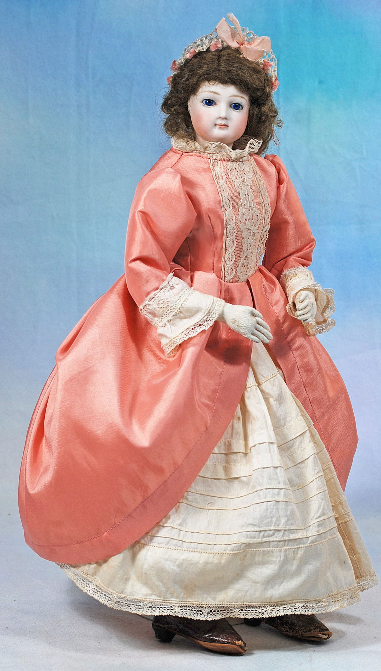 FRENCH BISQUE POUPEE.: 262. FRENCH BISQUE POUPEE. 17”. Marks: None. Bisque swivel head on bisque shoulderplate, cobalt blue inset glass eyes, painted lashes, feathered brows, pierced ears, closed mouth, accented