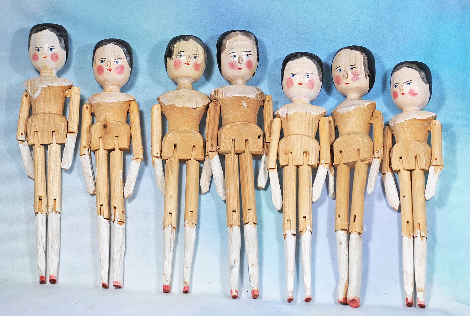 SEVEN GRODNERTAL WOODEN DOLLS. (1 of 1)
