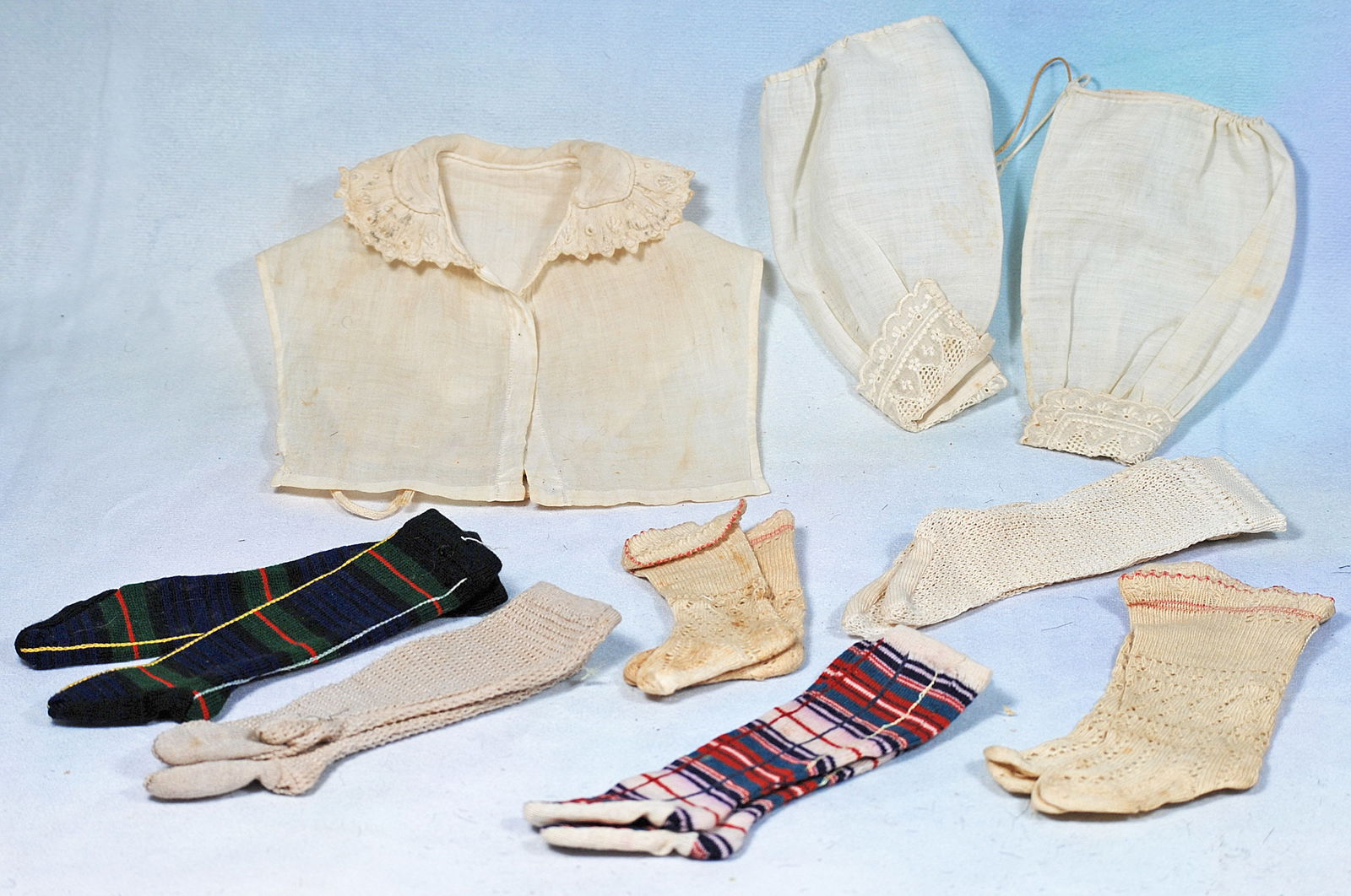 DOLL STOCKINGS, WHITE COTTON DICKEY AND SLEEVES. (1 of 1)