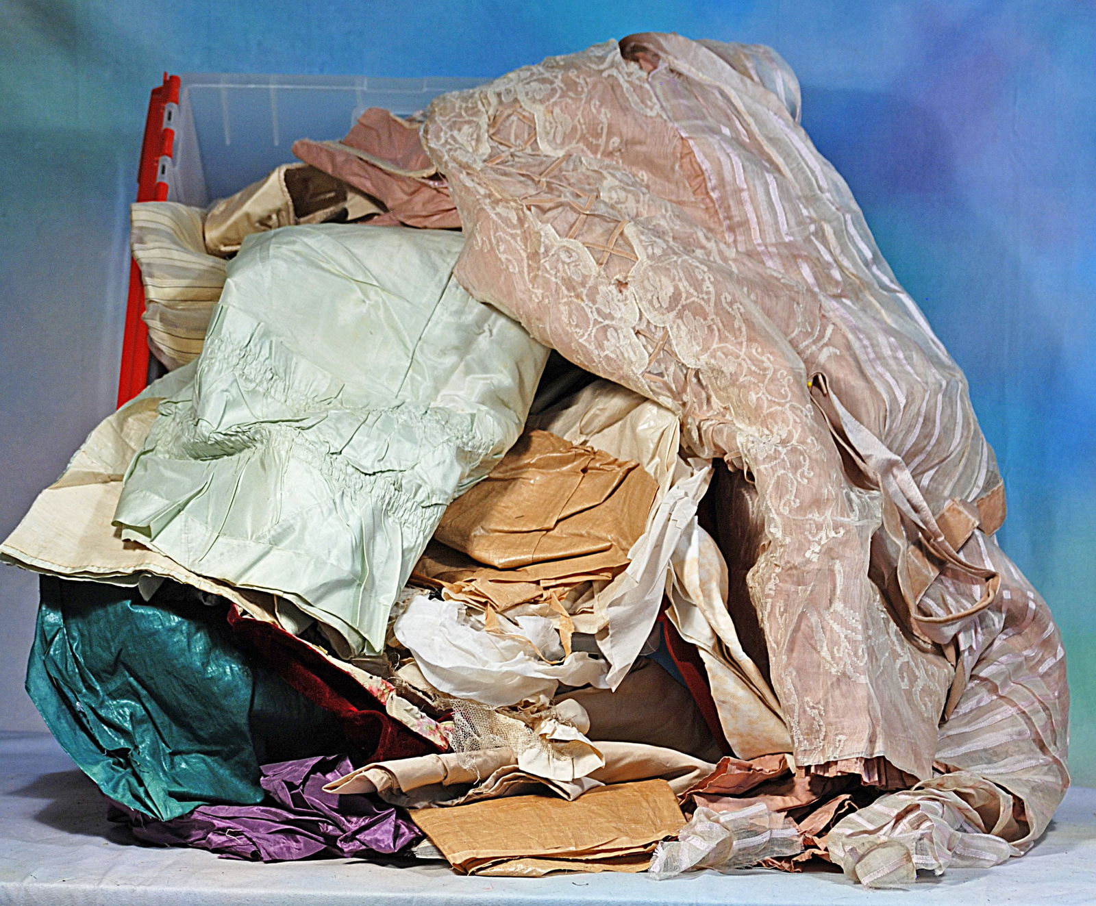LARGE CONTAINER OF VICTORIAN ERA FABRICS AND GARMENTS (1 of 1)