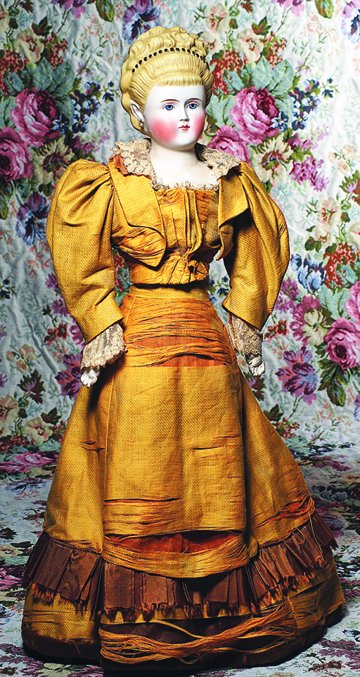 PARIAN LADY WITH FANCY DECORATED HAIR - IN ORIGINAL: PARIAN LADY WITH FANCY DECORATED HAIR - IN ORIGINAL GOWN. 24”. Bisque shoulderhead, elaborately-arranged blonde hair with short bangs and hair swept high into curls and braids with comb-marked detai