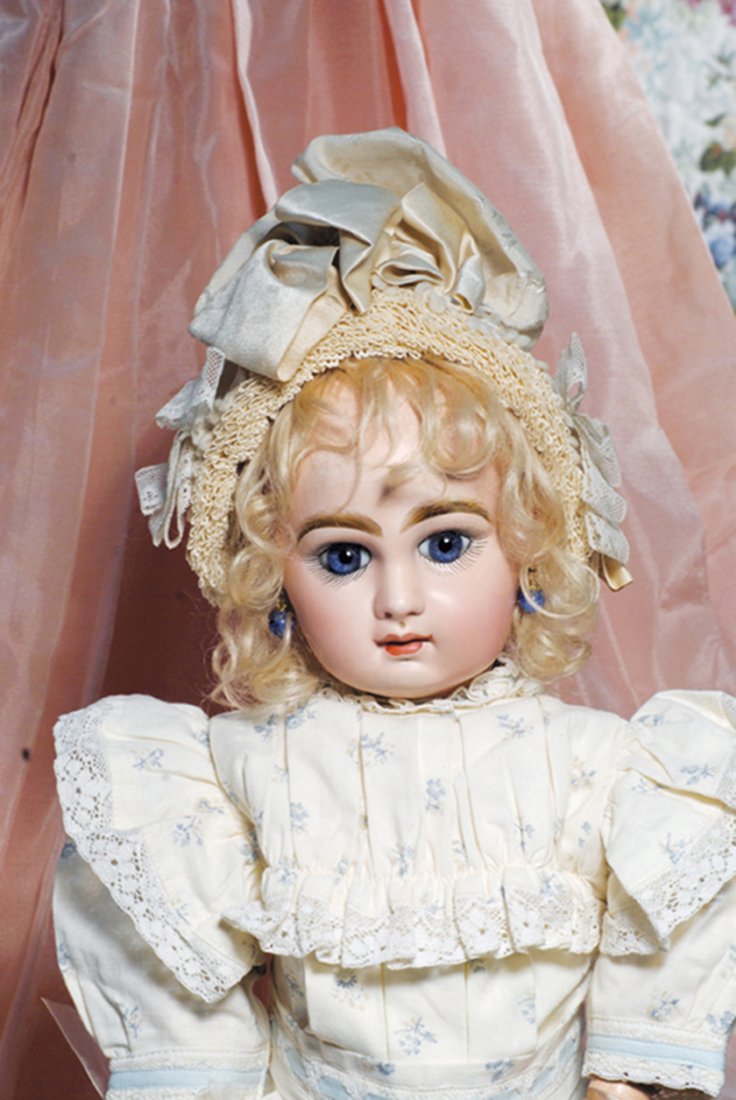 FRENCH BISQUE BEBE JUMEAU WITH SPLENDID BLUE EYES.: FRENCH BISQUE BEBE JUMEAU WITH SPLENDID BLUE EYES. Marks: Depose Tete Jumeau Bte sgdg 9. 20”. Bisque socket head, deep blue paperweight eyes, lushly-painted lashes, brushstroked and feathered brows,