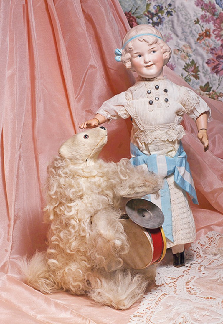 RARE FRENCH MUSICAL-MECHANICAL “BEAR DRUMMER” BY: RARE FRENCH MUSICAL-MECHANICAL “BEAR DRUMMER” BY DECAMPS. 10”H. Lush, thick white fur-covered papier mache bear is posed on back feet, has glass eyes and brushed muzzle, black nose; holds a larg