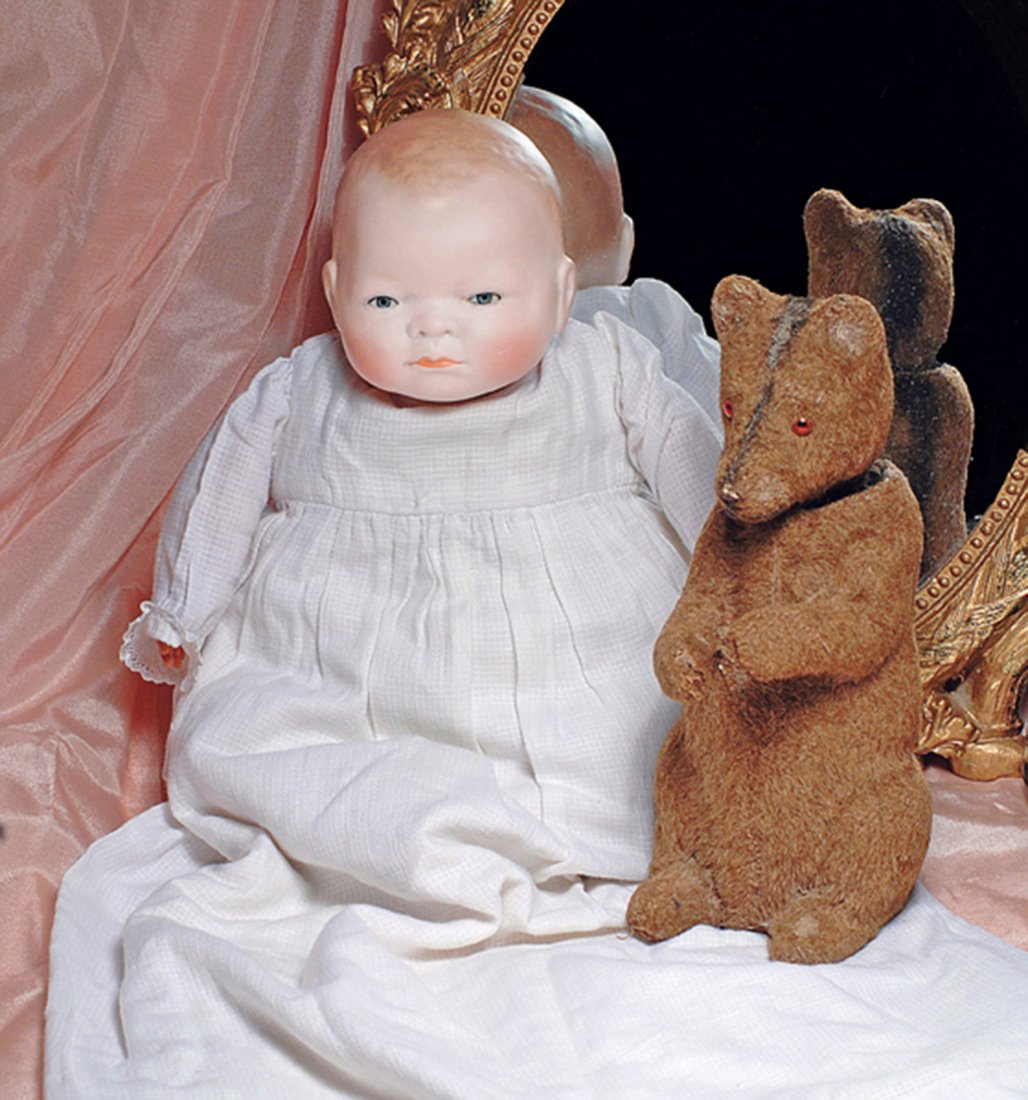 GERMAN BISQUE BYE-LO BABY. Marks: Copr. Grace S.: GERMAN BISQUE BYE-LO BABY. Marks: Copr. Grace S. Putnam. 10 ¼” head circumference. Solid-dome bisque swivel head, molded and painted light brown curly hair, blue sleep eyes, painted lashes, tinted 