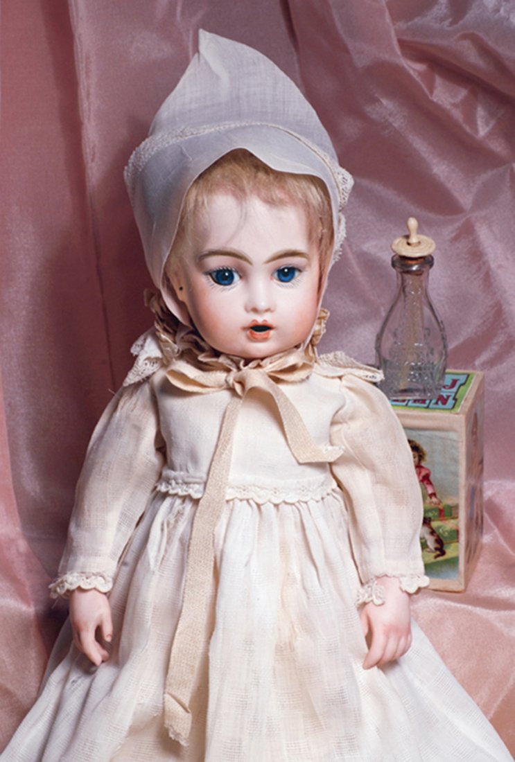 FRENCH BISQUE “BEBE TETEUR” BY LEON CASIMIR BRU.: FRENCH BISQUE “BEBE TETEUR” BY LEON CASIMIR BRU. Marks: Bru Jne 2 (head) Bru Jne 4 T (shoulderplate). 13 ½”. Bisque swivel head on kid-edged bisque shoulderplate with modeled bosom and shoulder