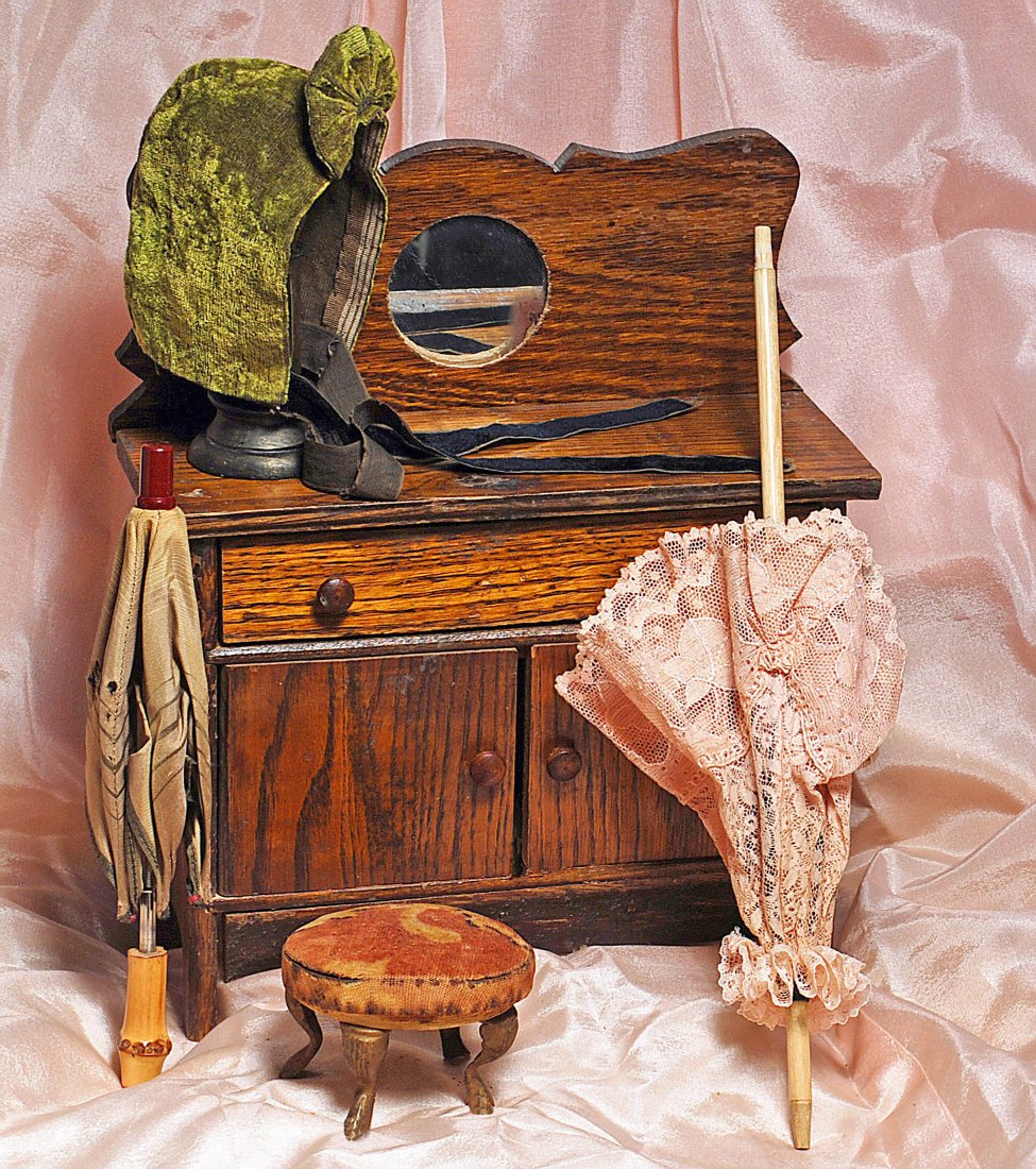 DOLL PARASOLS, MINIATURE FOOT STOOL & SIDEBOARD.: 271. DOLL PARASOLS, MINIATURE FOOT STOOL & SIDEBOARD. Includes: (1) Round wooden foot stool with printed velvet covering, four curved and gold-finished legs, marked "J. Gilbert, Wichita, Kansas" on bo