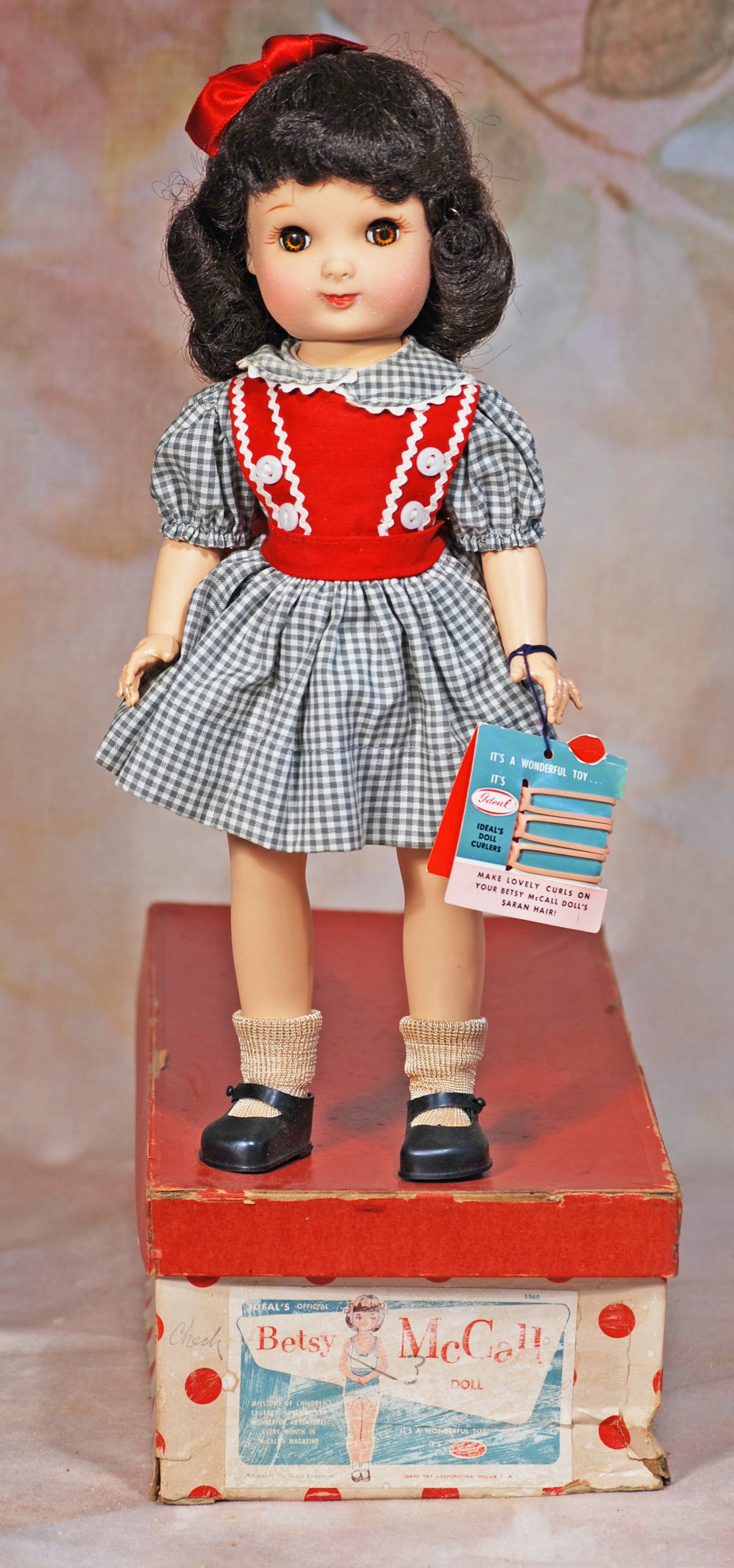 IDEAL BETSY MC CALL IN ORIGINAL BOX: 21. IDEAL BETSY MC CALL IN ORIGINAL BOX. 14”. Vinyl socket head doll, five-piece jointed body, brunette wig, sleep eyes, original cotton dress, vinyl shoes, has original wrist tag with curlers