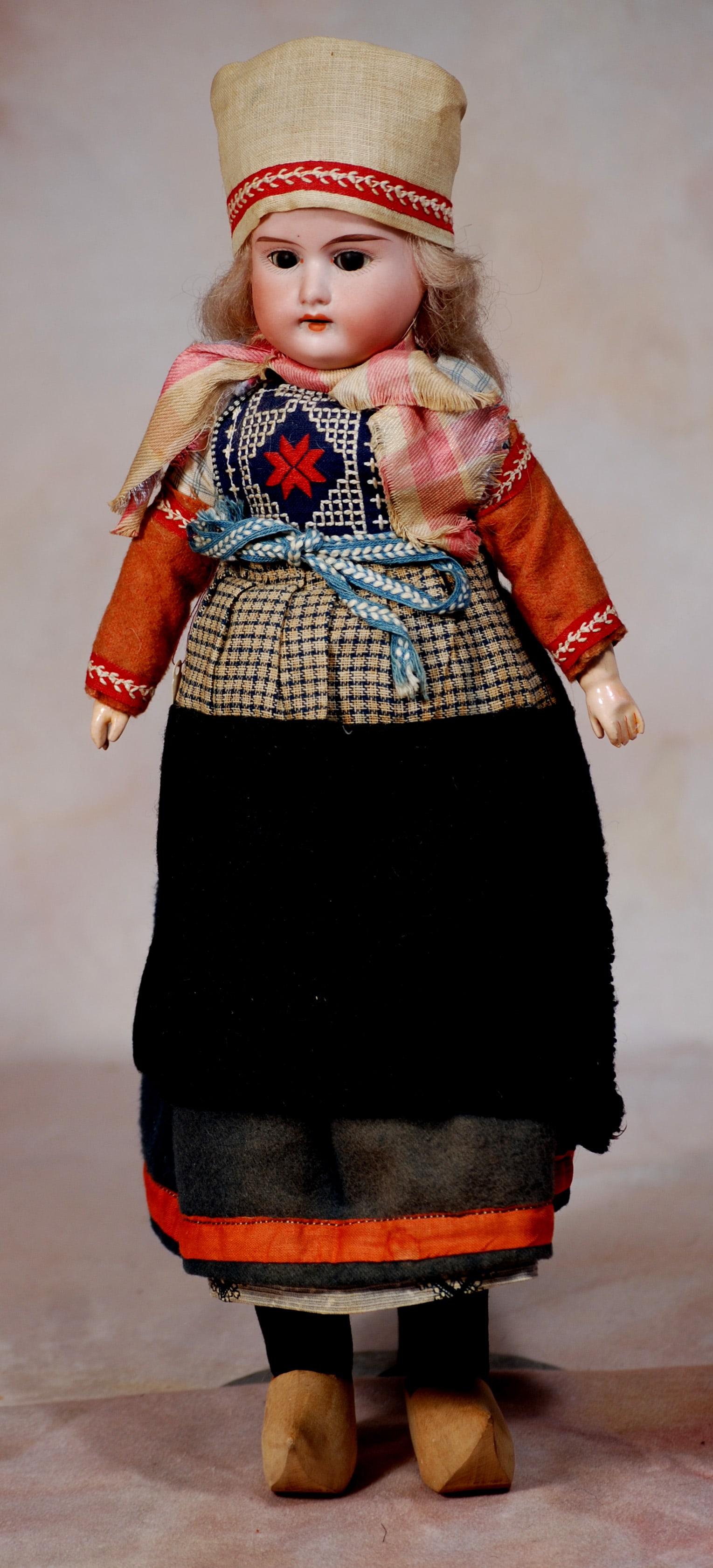 GERMAN BISQUE DOLL IN ORIGINAL FOLK LORE COSTUME.: 34. GERMAN BISQUE DOLL IN ORIGINAL FOLKLORE COSTUME. 13”. Marks: A M. 8/0. Bisque shoulderhead, brown sleep eyes, open mouth, mohair wig, cloth body with composition hands, provincial costume.