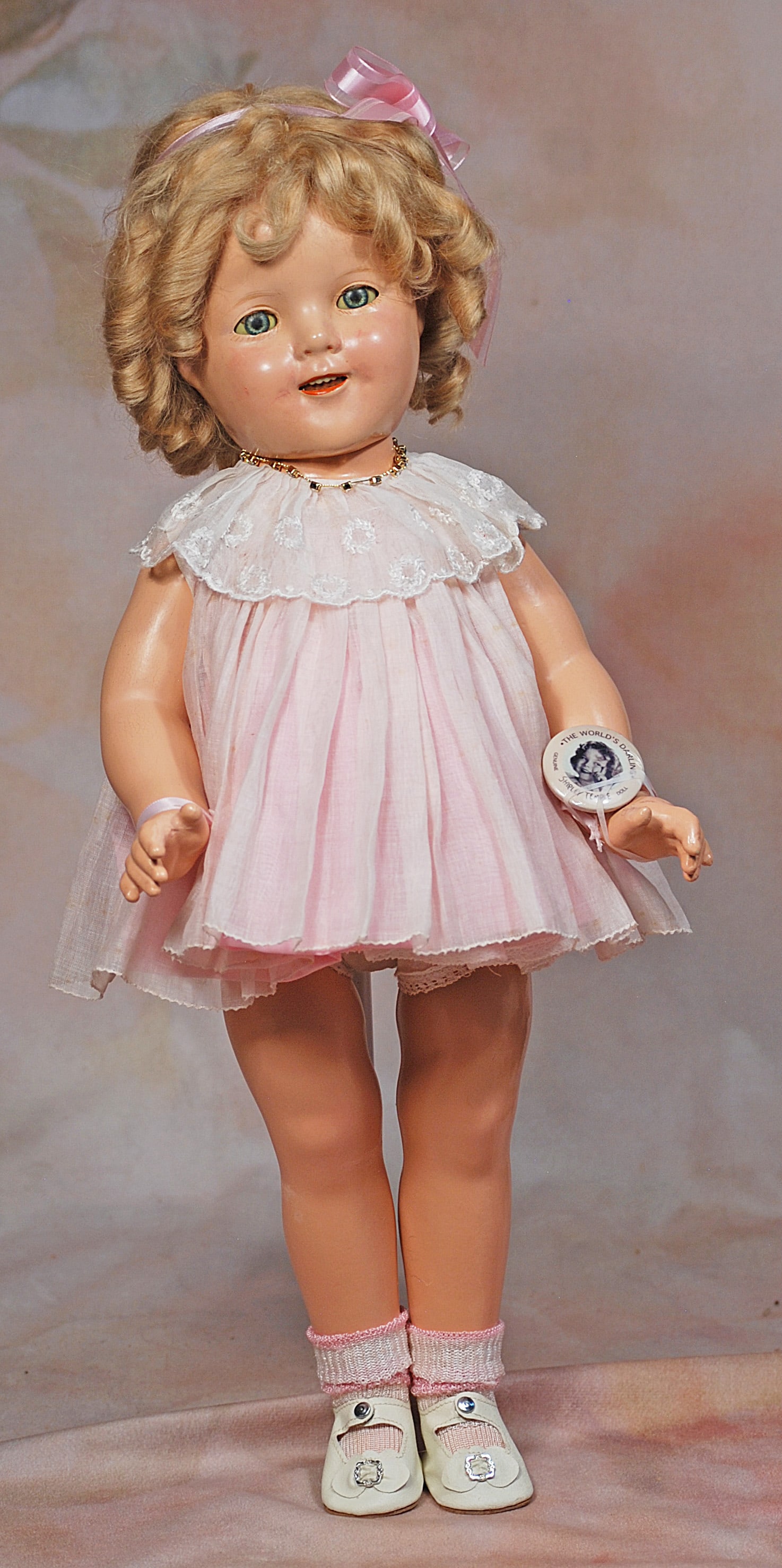 OMPOSITION SHIRLEY TEMPLE BY IDEAL.: 44. COMPOSITION SHIRLEY TEMPLE BY IDEAL. 18”. Marks: Shirley Temple copr. Ideal N & T. Composition socket head, five-piece jointed body, sleep eyes, open mouth, upper teeth, blonde mohair curly 