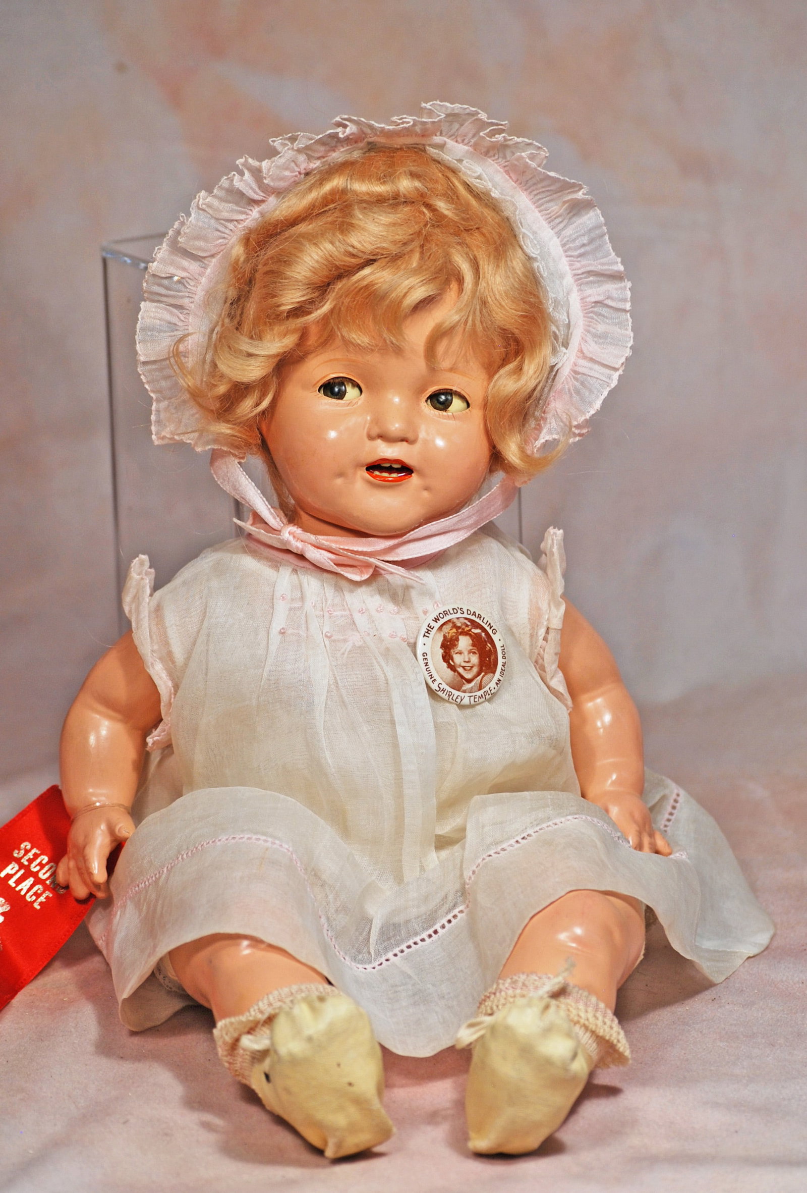 COMPOSITION BABY SHIRLEY TEMPLE BY IDEAL: 45. COMPOSITION BABY SHIRLEY TEMPLE BY IDEAL. 15”. Marks: Shirley Temple. Composition swivel head on composition shoulderplate, cloth body with composition arms and lower legs, flirty and sleep 