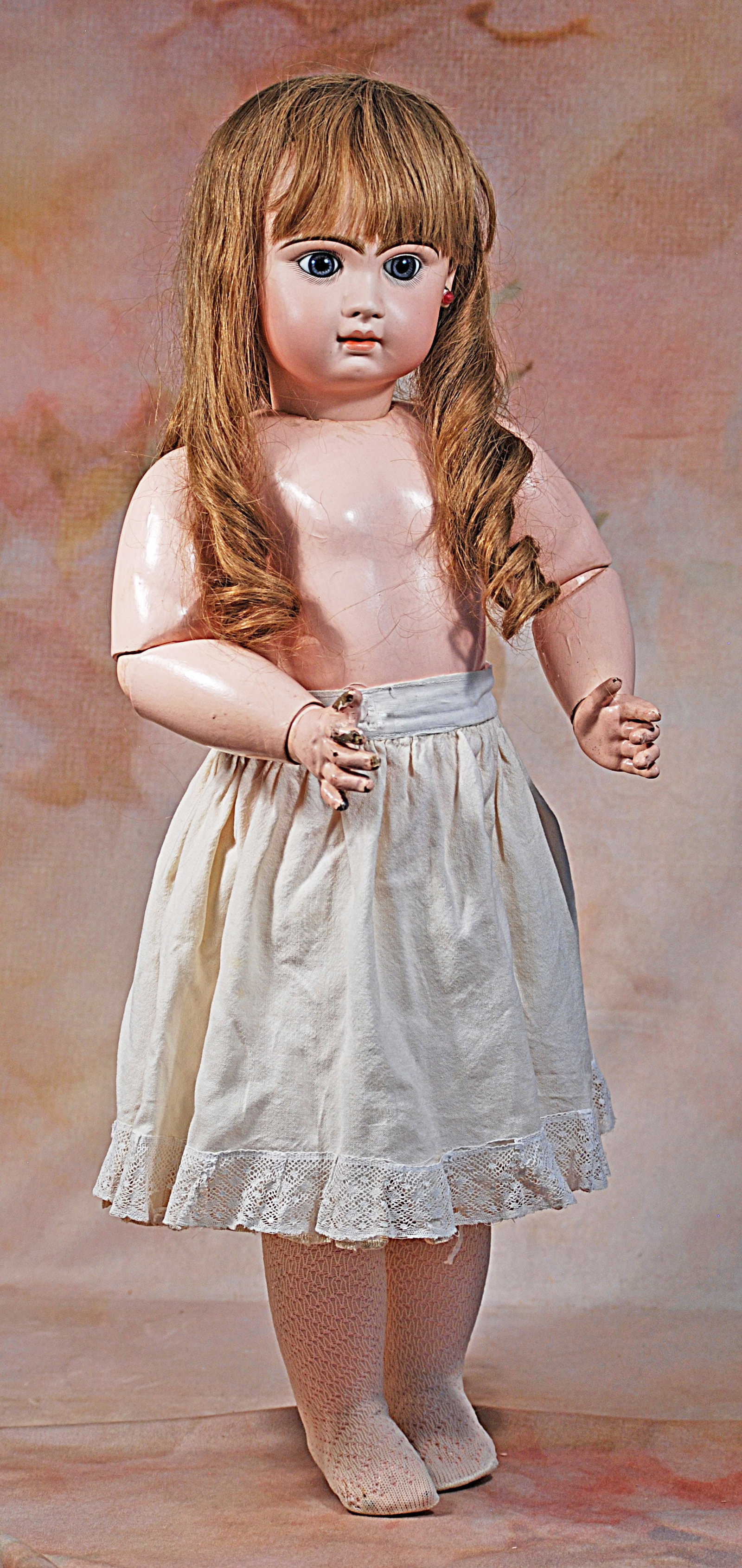 FRENCH BISQUE BEBE BY JUMEAU.: 110. FRENCH BISQUE BEBE BY JUMEAU. 27”. Marks: Tete Jumeau Bte SGDG Depose. Bisque socket head, blue paperweight eyes, painted lashes, eyeliner, feathered brows, closed mouth, shaded and accente
