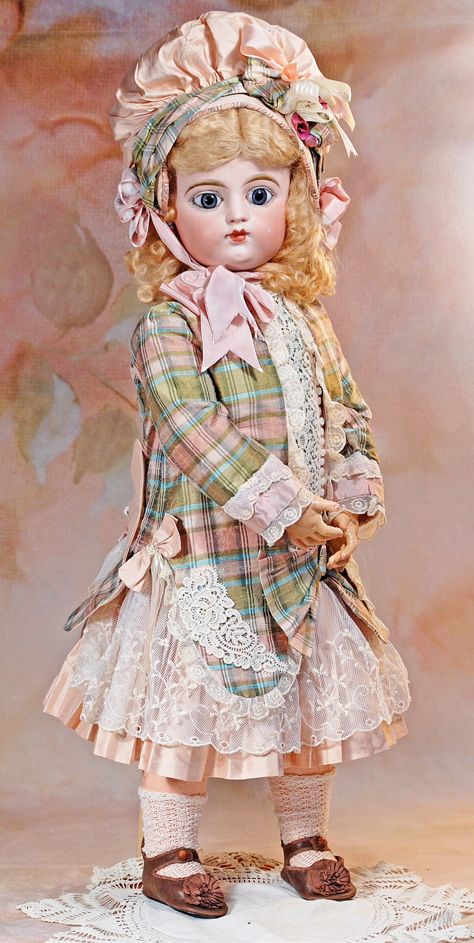 FRENCH BISQUE BEBE, SIZE 11, BY GAULTIER FRERES.: 11-A. FRENCH BISQUE BEBE, SIZE 11, BY GAULTIER FRERES. 30”. Marks: 11 F.G. (scroll). Bisque socket head with rounded face and plump cheeks, large blue paperweight eyes, painted lashes, dark