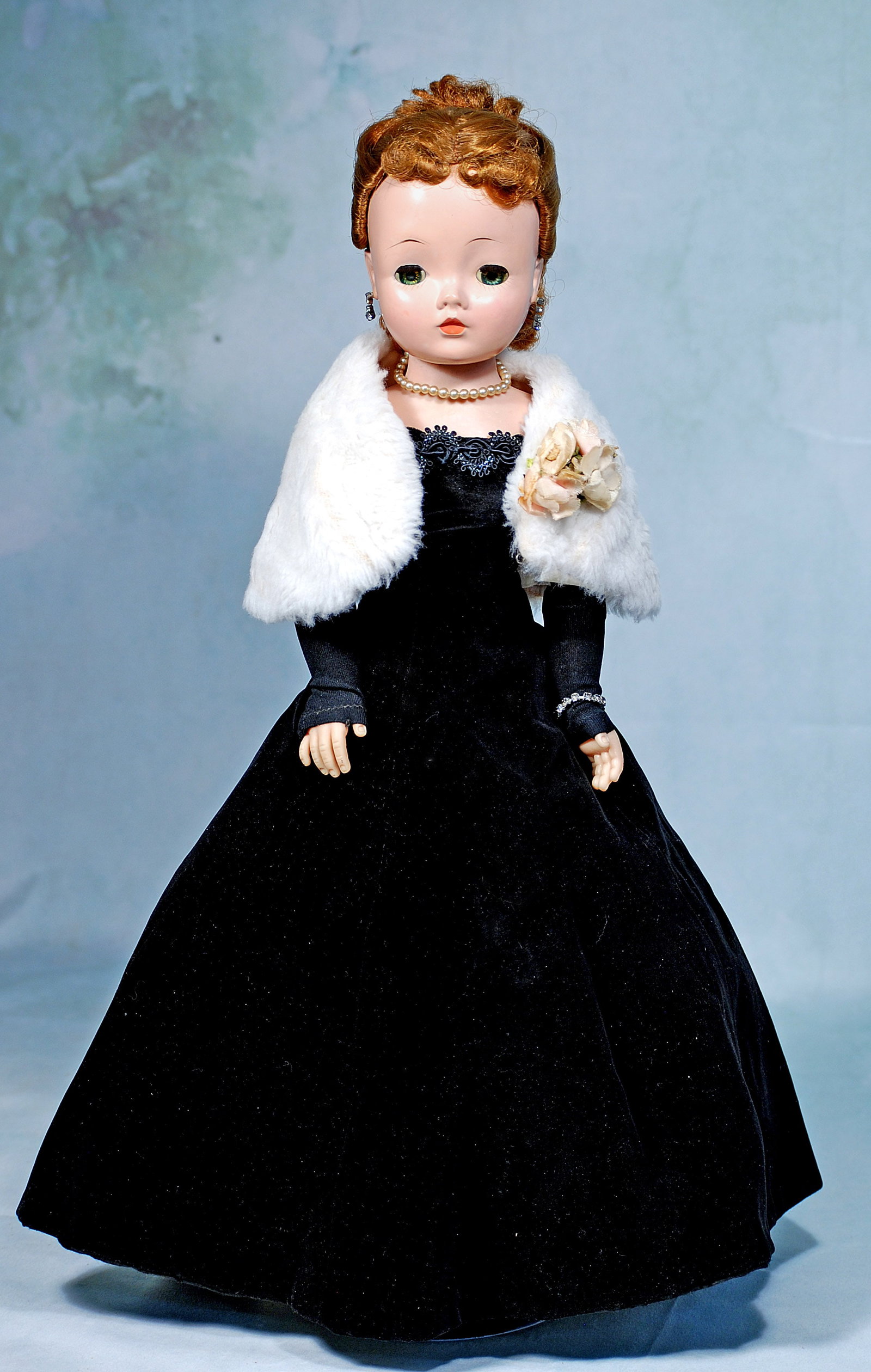 ALEXANDER 1957 CISSY IN BLACK VELVET GOWN.: 28-A. ALEXANDER 1957 CISSY IN BLACK VELVET GOWN. 20”. Hard plastic socket head, jointed lady body, sleep eyes, original auburn wig, wearing fitted black velvet sheath gown with black/silver