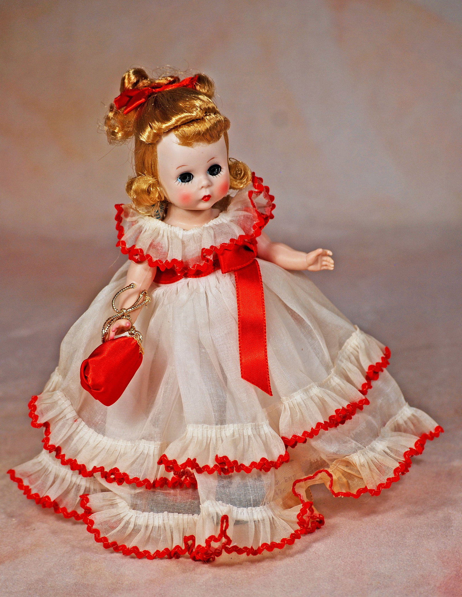 ALEXANDER-KINS AS WENDY LOVES TO WALTZ: 137. ALEXANDER-KINS AS “WENDY LOVES TO WALTZ”. 8”. Hard plastic straight-leg walker, blue sleep eyes, blonde wig with short bangs and curls, wearing tagged white organdy formal gown with