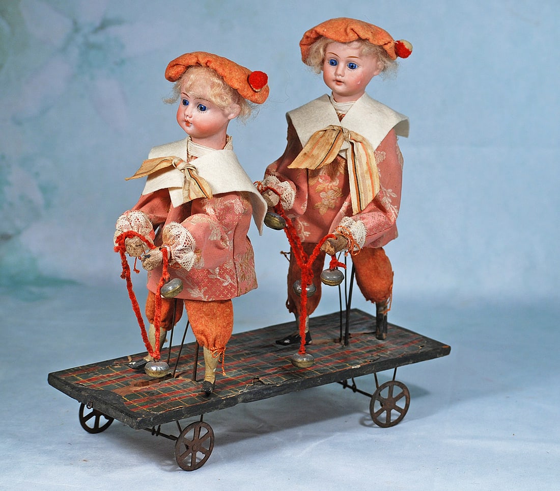 GERMAN MECHANICAL PULL TOY WITH TWO BISQUE DOLLS (1 of 1)