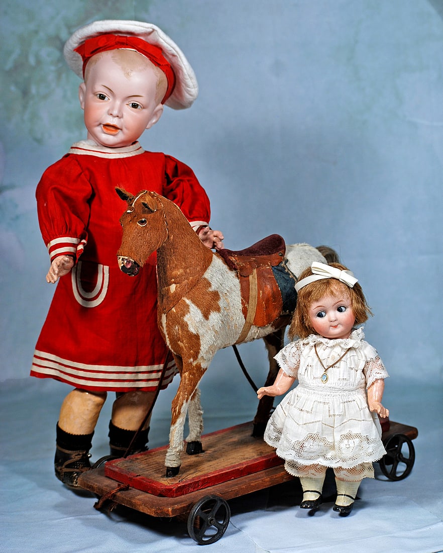 FRENCH BISQUE CHARACTER BOY, MODEL 235, BY SFBJ: 16”. Marks: SFBJ 235 Paris 6. Solid domed bisque socket head with sculpted boyish hair, defined forelock, brown glass inset eyes, painted lashes, dark eyeliner, tapered brows, closed mouth with 