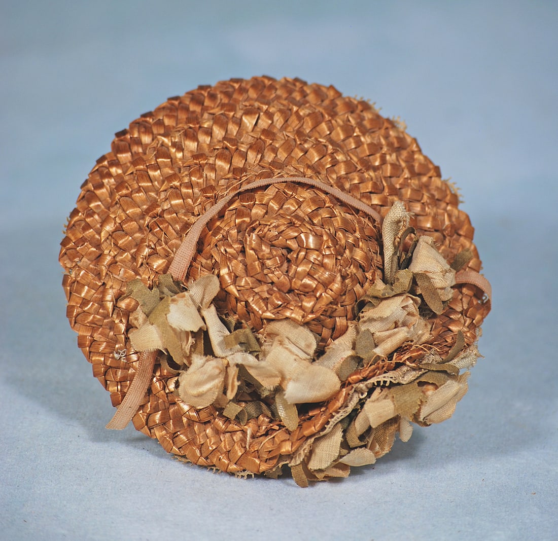 ANTIQUE STRAW DOLL BONNET FOR SMALL DOLLS: Woven natural straw bonnet with 1 ¼” deep lace-covered brim, accented with clusters of flower on the outside and inside of the brim, sized for approximately 5” to 6” head circum