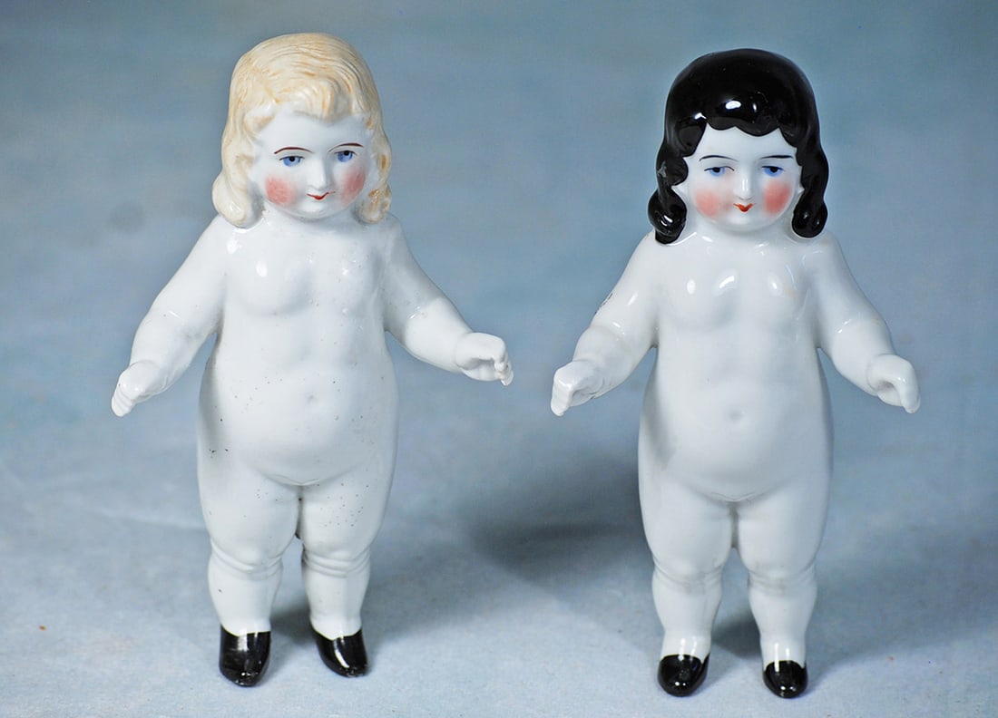 PAIR OF GERMAN PORCELAIN DOLLS AS PENNY BANKS (1 of 1)