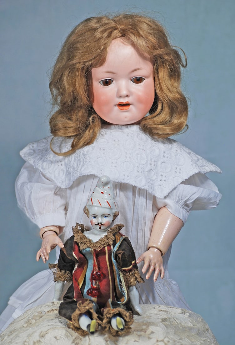 GERMAN BISQUE CHARACTER, MODEL 590, BY MARSEILLE: 18”. Marks: 590 A 5 M Germany DRGM. Bisque socket head, blue sleep eyes, painted lashes, feathered brows, deep cheek dimples, open/closed mouth with modeled detail between shaded lips,original b