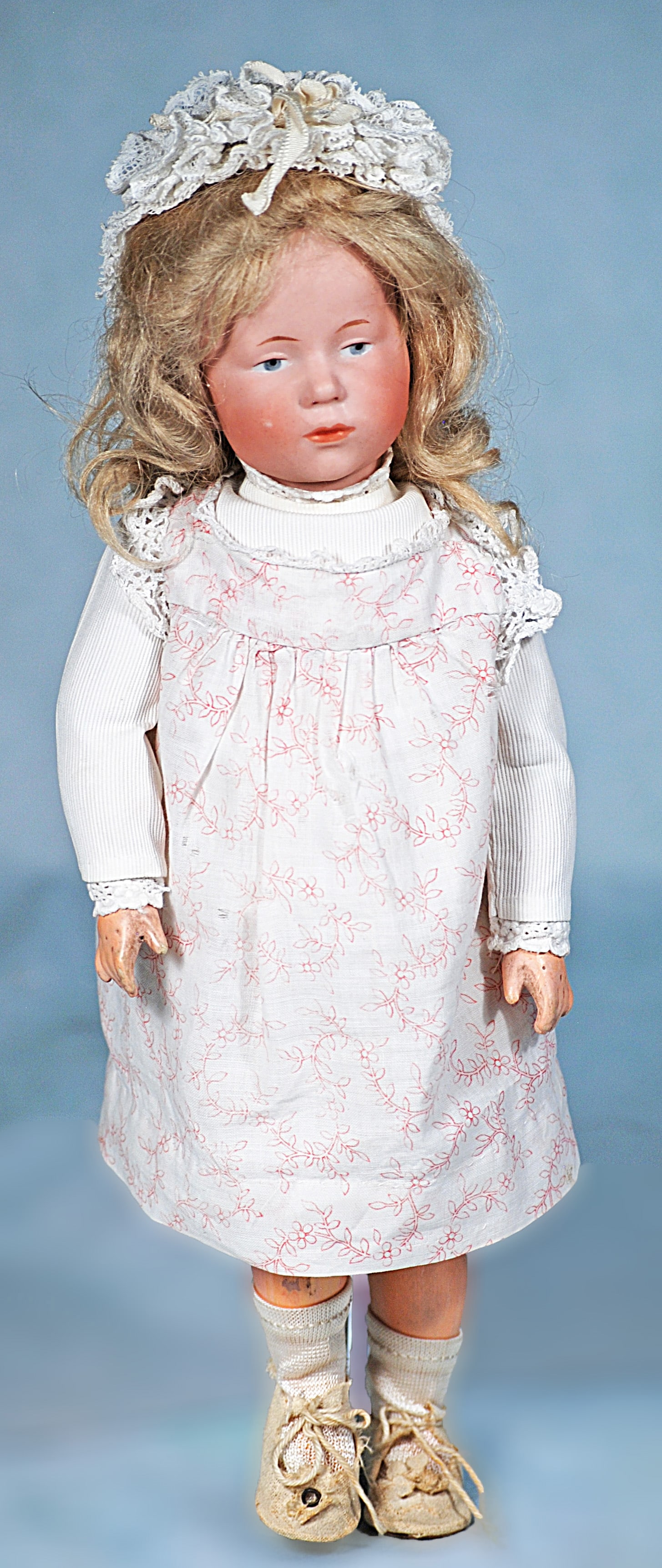 PETITE KAMMER AND REINHARDT BISQUE CHARACTER DOLL KNOWN AND “MARIE”: 12”. Marks: K * R 30 101. Bisque socket head, painted features, blue eyes, upper eyeliner, tapered brows, closed mouth, pouty expression, antique blonde mohair wig, composition and wooden ball-j