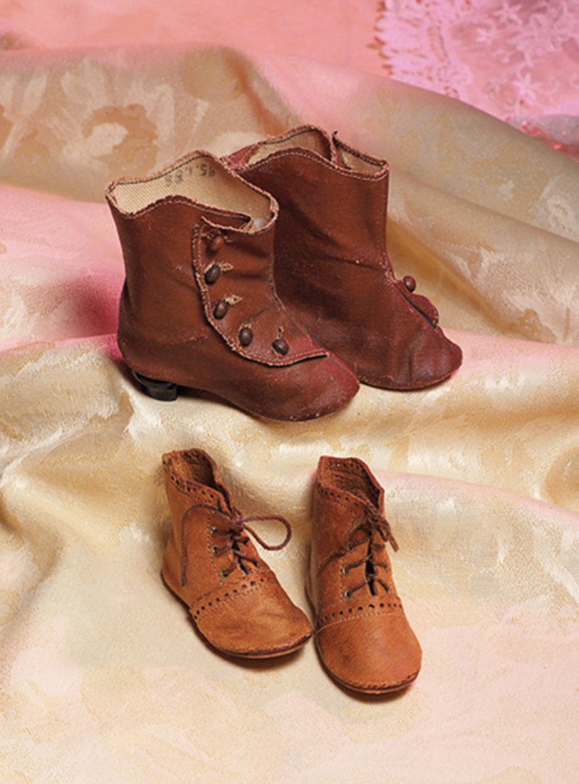 TWO PAIR OF ANTIQUE DOLL BOOTS. (1) 3” L. pair of: TWO PAIR OF ANTIQUE DOLL BOOTS. (1) 3” L. pair of brown leather high-button boots with five-button side closing, stitched edges, nailed-on black wooden heels; (2) 3” L. pair of tan leather ankle b