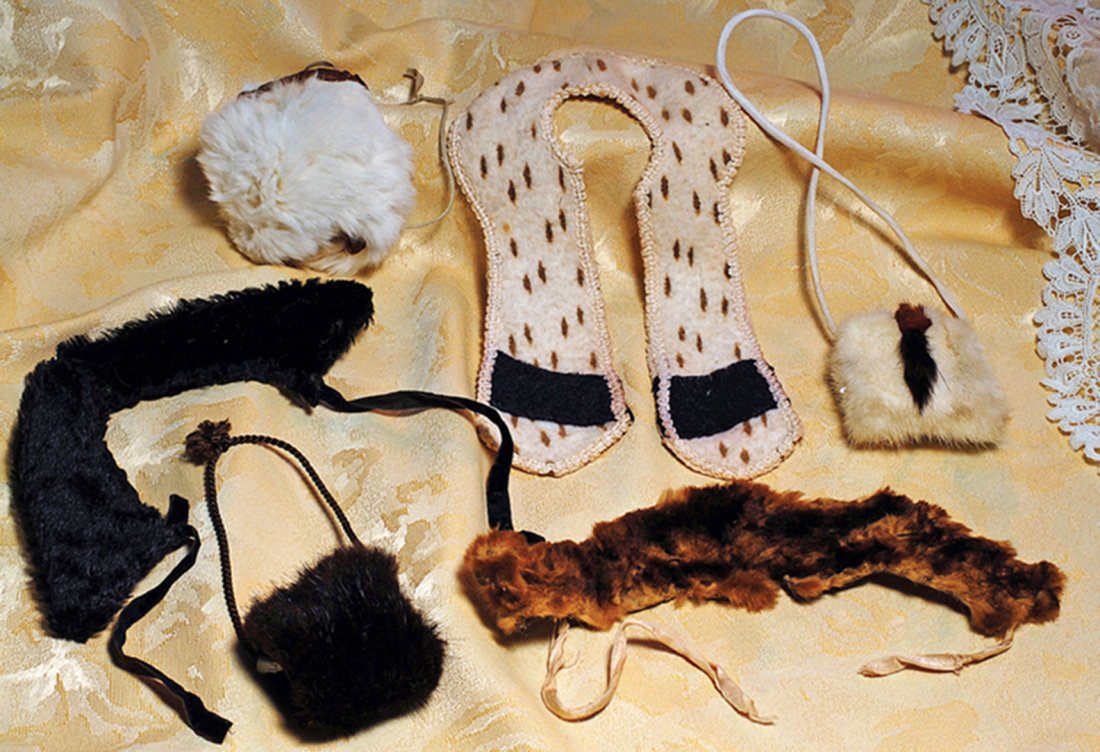 GROUP OF FUR COLLARS AND MUFFS. Includes: 9” black fur: GROUP OF FUR COLLARS AND MUFFS. Includes: 9” black fur collar with taffeta lining, velvet ties, 2” W. black fur muff; 9” long faux ermine color with black bands and decorative edging, suitable f