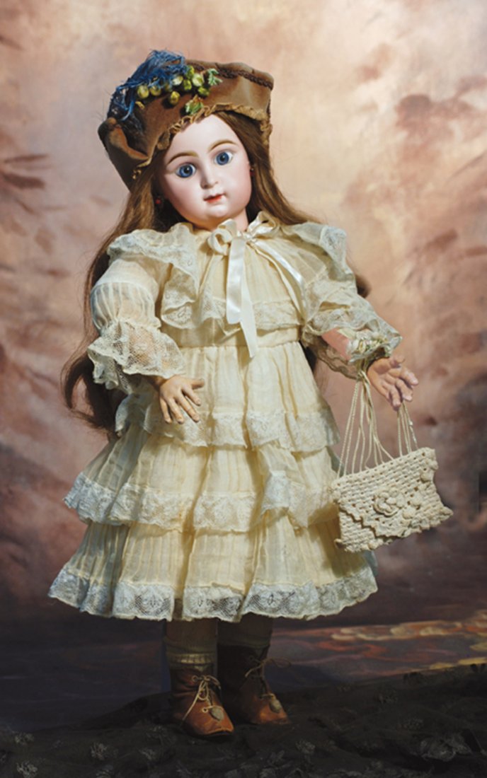 RARE FRENCH BISQUE CHARACTER-FACE TRADEMARK “PARIS: RARE FRENCH BISQUE CHARACTER-FACE TRADEMARK “PARIS BEBE” BY EMILE JUMEAU. Marks: Paris Bebe, Tete Deposee, 10. 22”. Bisque socket head, large blue paperweight eyes, painted lashes, eyeliner, fea