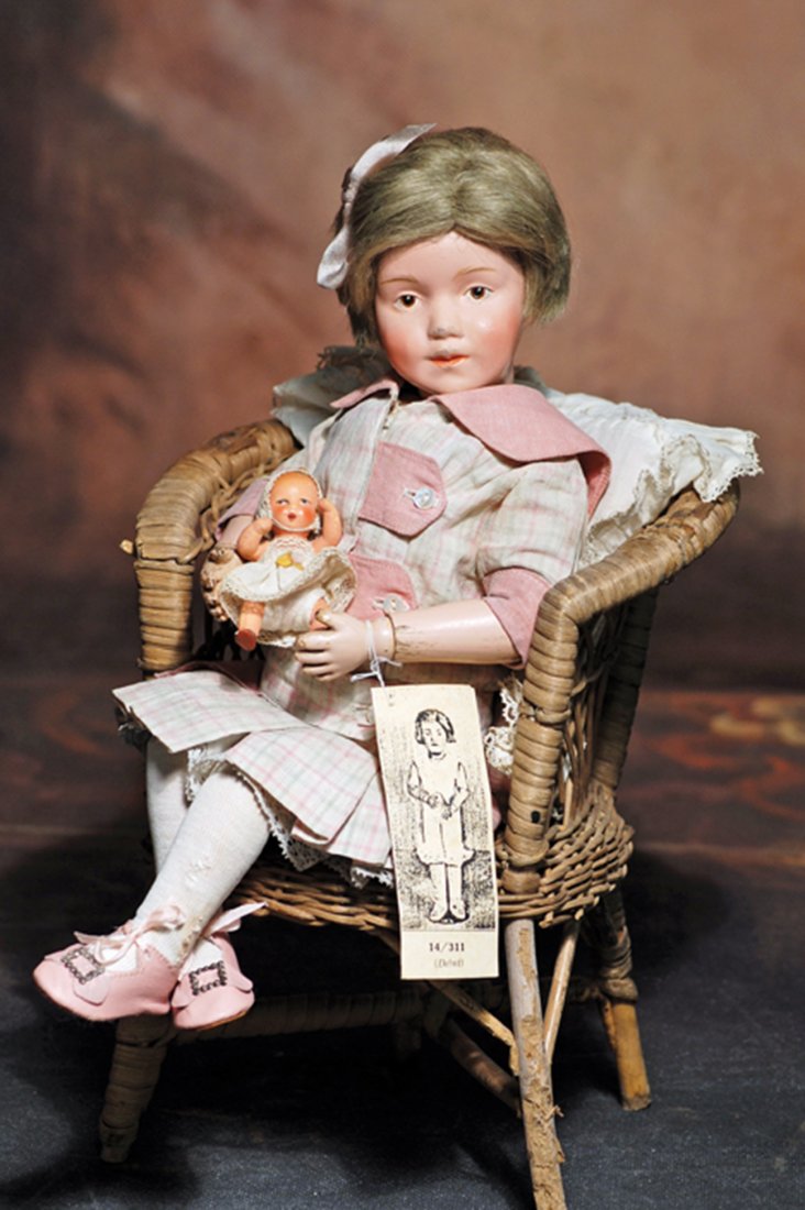 SCHOENHUT CHARACTER GIRL, MODEL 311, IN ORIGINAL DRESS.: SCHOENHUT CHARACTER GIRL, MODEL 311, IN ORIGINAL DRESS. Marks: Incised Schoenhut mark. 14 ½”. Carved wooden socket head, spring-jointed wooden body, painted features, brown intaglio eyes, upper eye