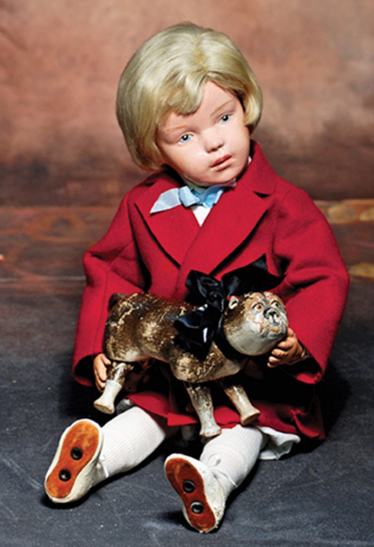 SCHOENHUT CARVED WOODEN BULLDOG. 6 ½” L. Wooden dog: SCHOENHUT CARVED WOODEN BULLDOG. 6 ½” L. Wooden dog with swivel head and jointed legs, painted dark brown and white finish, painted brown eyes, leather ears and short curved tail. Commentary: Rare