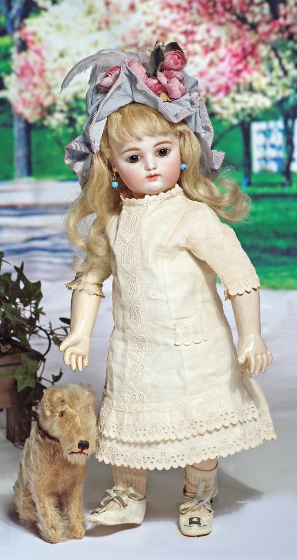 PRETTY FRENCH BISQUE BEBE BY RABERY & DELPHIEU. Marks:: PRETTY FRENCH BISQUE BEBE BY RABERY & DELPHIEU. Marks: R. 2/0 D. 15”. Bisque socket head, brown paperweight eyes, painted lashes, feathered and brushstroked brows, pierced ears, closed mouth, shaded