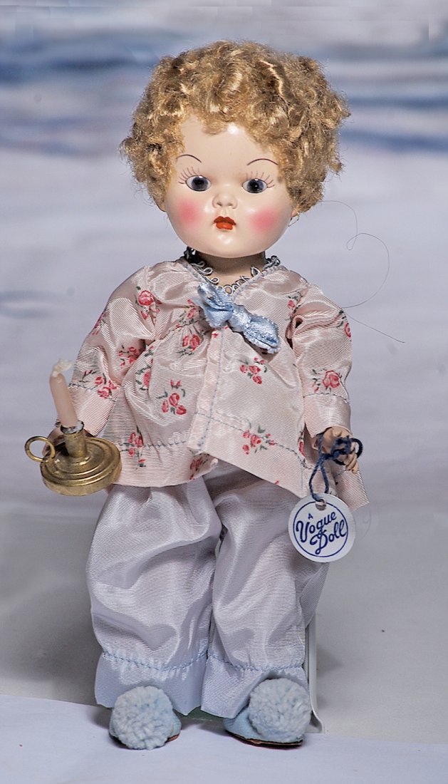 EARLY VOGUE “WEE WILLIE WINKIE” DOLL WITH POODLE WIG.: EARLY VOGUE “WEE WILLIE WINKIE” DOLL WITH POODLE WIG. 8”. All-hard plastic, strung doll, blonde poodle wig, brown sleep eyes, painted lashes, tapered and arched brows, tagged pink floral print p