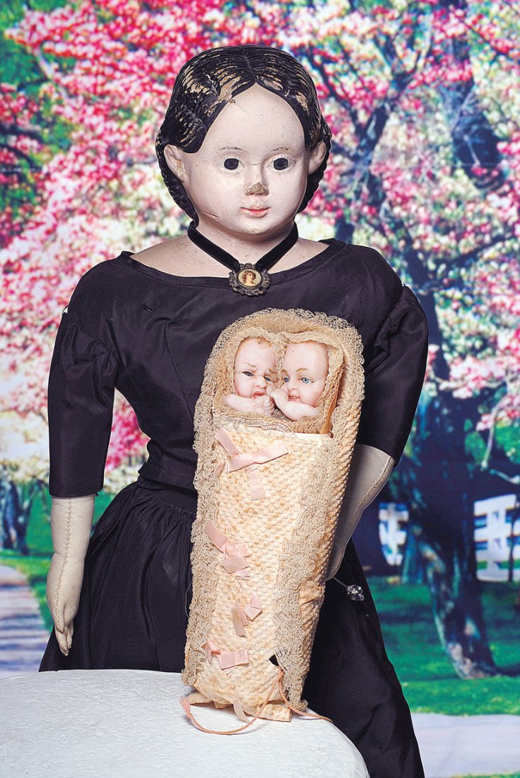 LARGE MODEL OF EARLY PAPIER MACHE DOLL BY GREINER.: LARGE MODEL OF EARLY PAPIER MACHE DOLL BY GREINER. Marks: Greiner’s 1858 patent mark. 33”. Papier mache shoulderhead with molded and painted black hair, center parted with curls behind fully-model