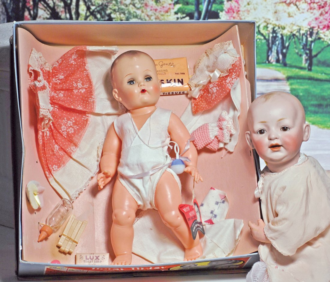 AMERICAN “BETSY WETSY BABY WITH LAYETTE” BY IDEAL.: AMERICAN “BETSY WETSY BABY WITH LAYETTE” BY IDEAL. 16”. Plastic and vinyl baby with molded hair, blue sleep eyes, eye shadow, painted and applied lashes, open-mouth nurser, jointed baby body, we