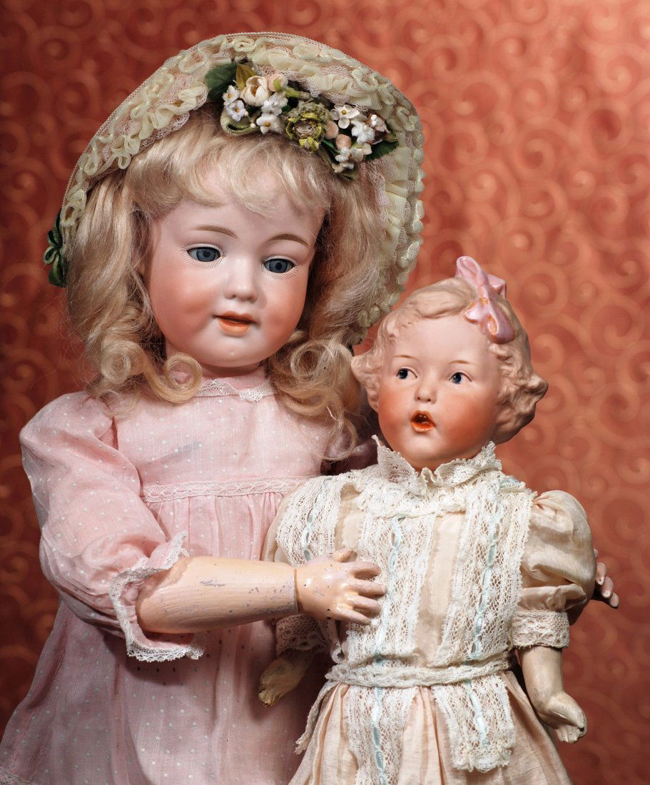 GERMAN BISQUE GLASS-EYED SMILING CHARACTER, 590, BY: GERMAN BISQUE GLASS-EYED SMILING CHARACTER, 590, BY MARSEILLE. Marks: 590 A 5 M Germany DRGM. 20”. Bisque socket head, blue sleep eyes, painted lashes, feathered brows, open closed mouth with modele