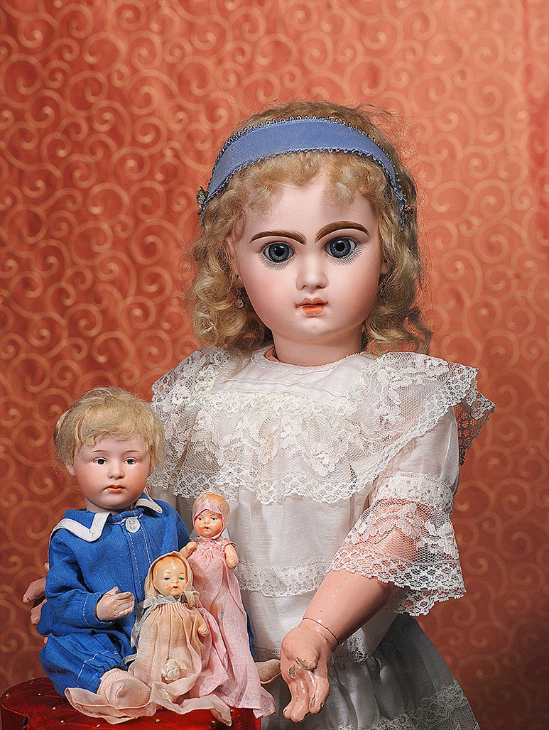 GERMAN BISQUE POUTY CHARACTER BY GEBRUDER HEUBACH: GERMAN BISQUE POUTY CHARACTER BY GEBRUDER HEUBACH. Marks: 6969, Heubach sunburst mark. 10”. Bisque socket head, intaglio blue eyes, deeply-molded eye lids, tapered brows, closed mouth, accented lips