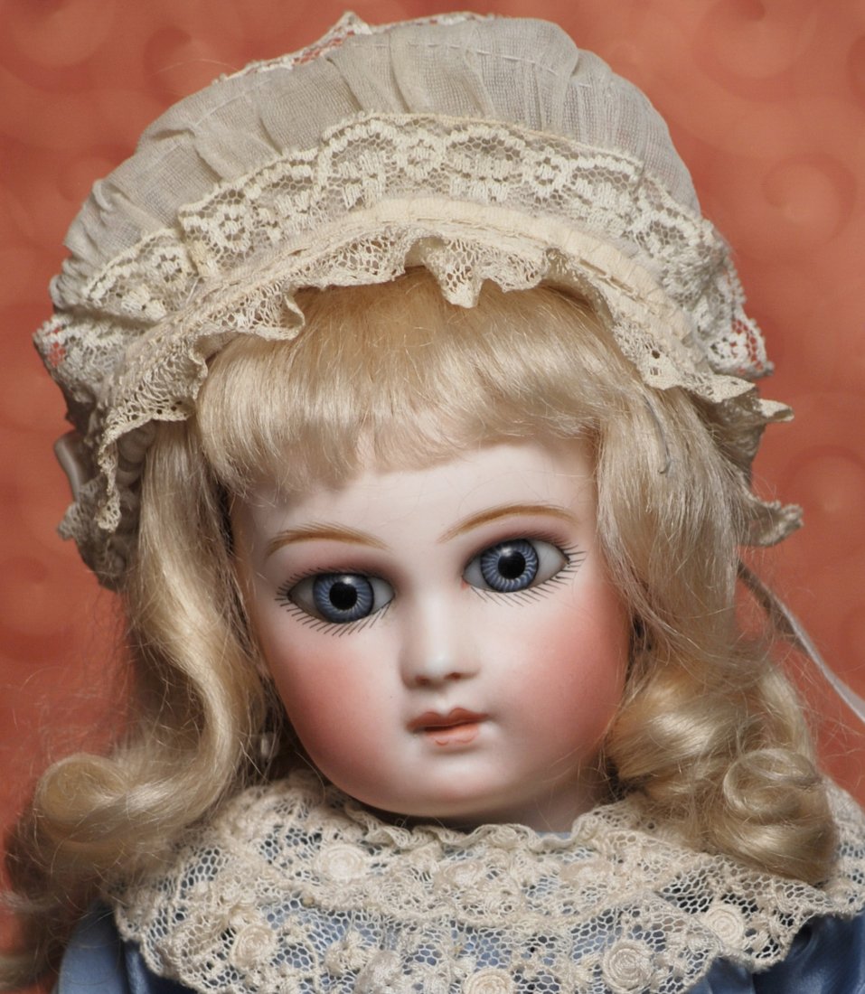 EARLIEST FRENCH BISQUE DELUXE PORTRAIT BEBE BY JUMEAU: EARLIEST FRENCH BISQUE DELUXE PORTRAIT BEBE BY JUMEAU WITH DRAMATIC “WRAP-AROUND” EYES. Marks: 0. 14 ½”. Pressed bisque socket head, very large spiral-threaded blue paperweight eyes in wide eye