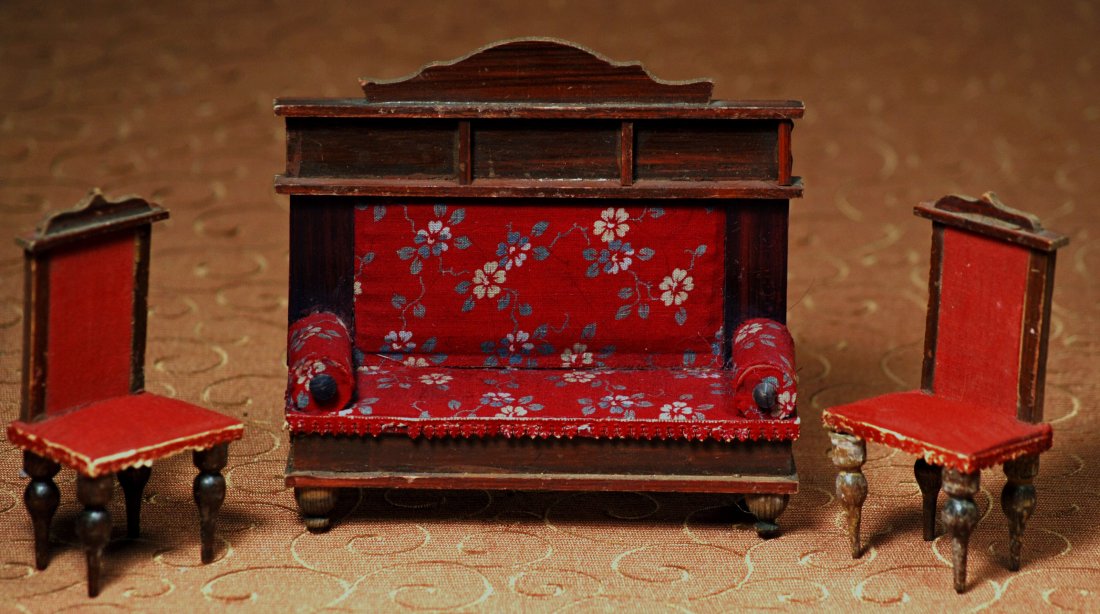 ANTIQUE GERMAN DOLL HOUSE FURNITURE BY GOTTSCHALCK: ANTIQUE GERMAN DOLL HOUSE FURNITURE BY GOTTSCHALCK. 5” H. x 5” W. high-back carved wooden settee with turned feet, rolled arms, deep red flowered upholstery; plus two side chairs with dark red uph