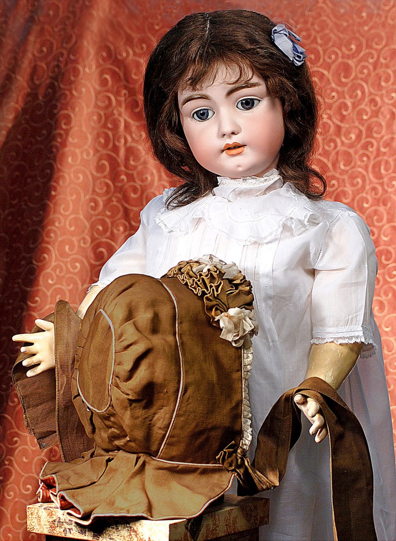 FINE ANTIQUE BONNET FOR LARGE DOLLS: FINE ANTIQUE BONNET FOR LARGE DOLLS. Brown silk faille padded bonnet designed with pale pink piping detail, pleated lace framing the front, deep pleated bavolet, thick brown faille ruching in front wi